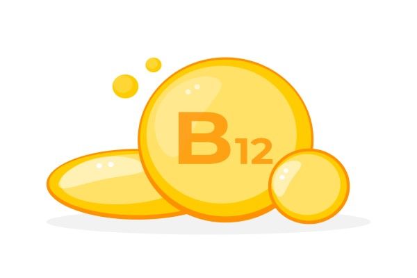 Cápsulas de suplemento de vitamina B12 representadas en amarillo vibrante para apoyar la energía y la función metabólica